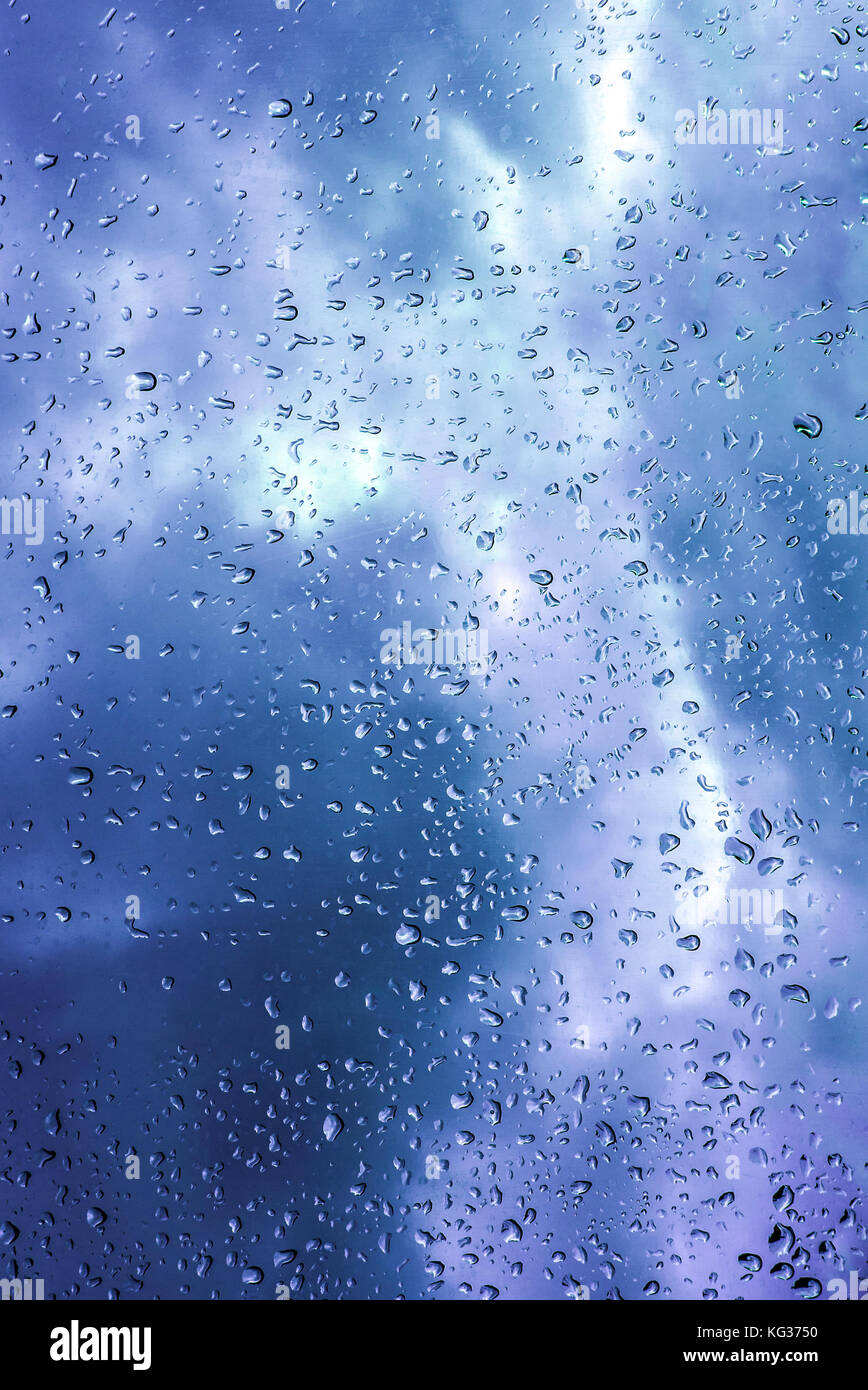 Water Drops on Glass on a raing day with clouds, Blue Stock Photo - Alamy