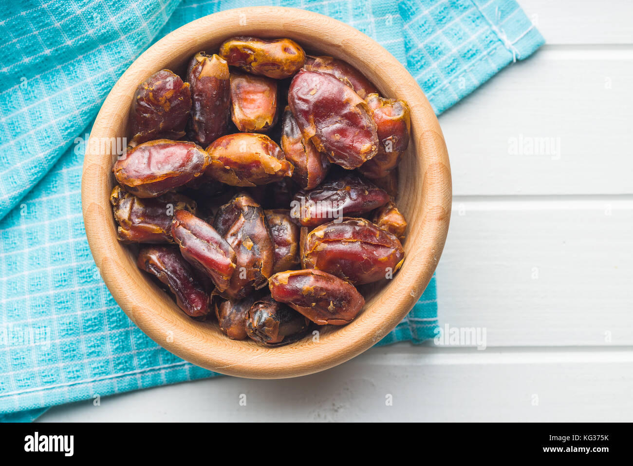 Sweet dates without stones in bowl. Stock Photo