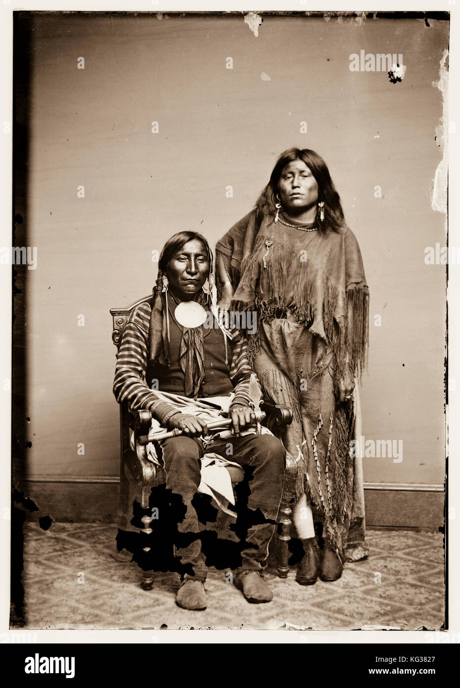 TITLE:  Lone Wolf and his wife Etla, Kiowa Indians RIGHTS INFORMATION:  No known restrictions on publication. MEDIUM:  1 negative : glass, wet collodion. CREATED/PUBLISHED:  [between 1855 and 1865] Stock Photo