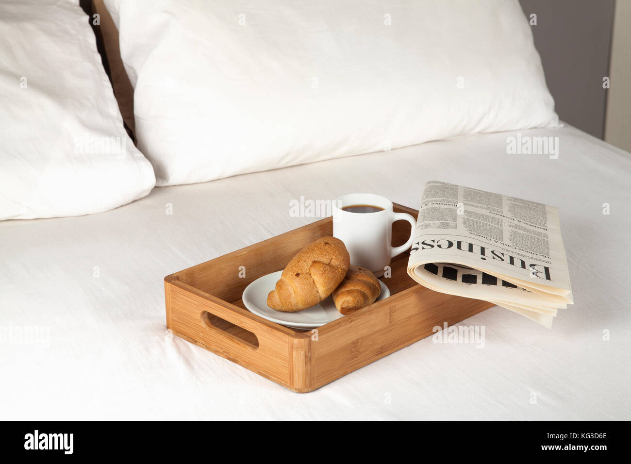 Breakfast tray and newspaper on a bed Stock Photo Alamy