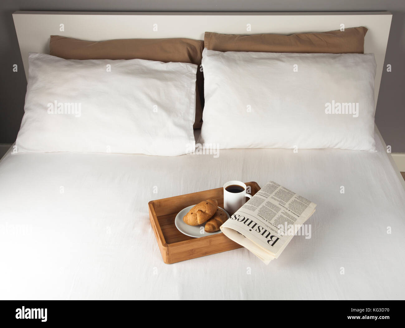 Breakfast tray and newspaper on a bed Stock Photo Alamy