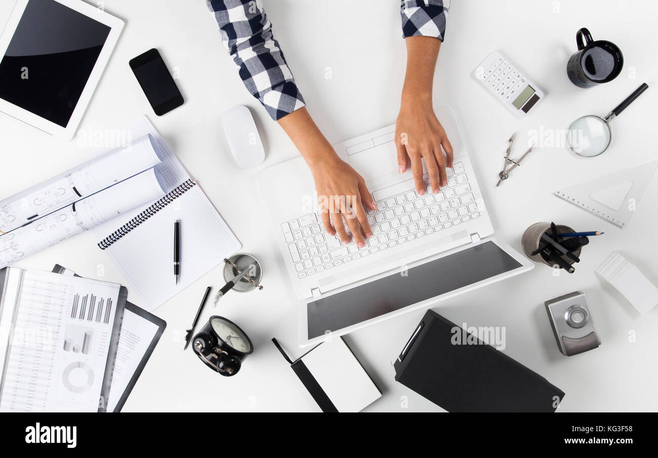 Overhead View Of Businesswoman Working At Computer In Office Stock