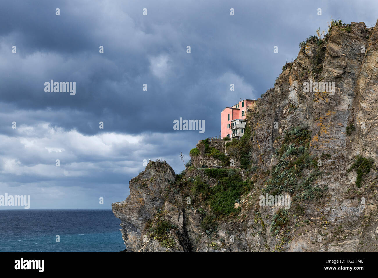 Remote house perched on seaside cliff, Cinque Terre, Liguria, Italy. Stock Photo