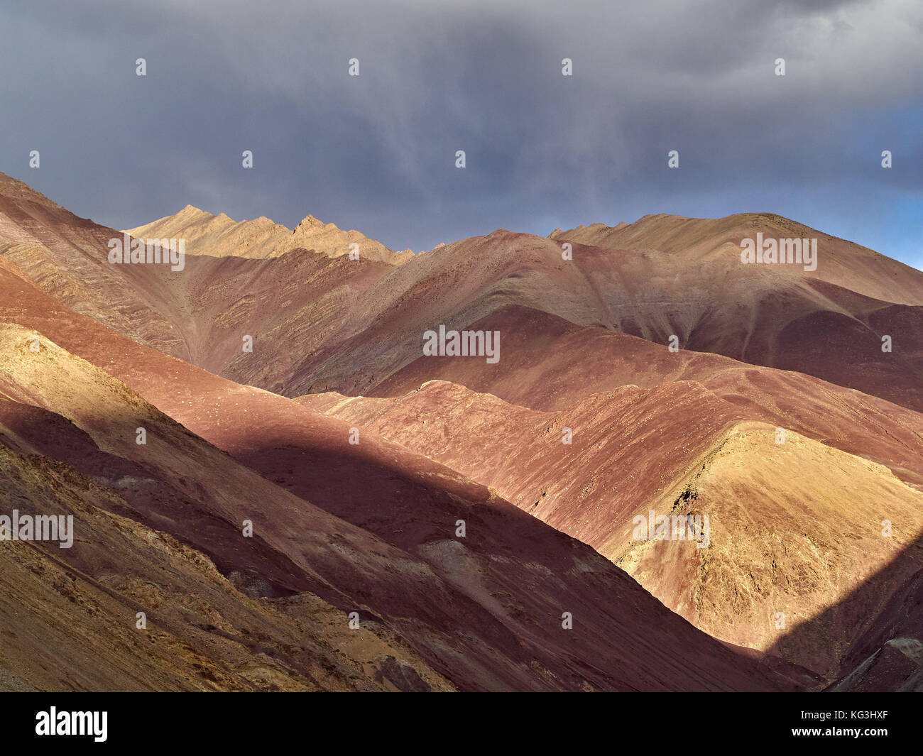 Mountain gorge from the sedimentary rock is red and yellow, the slopes ...