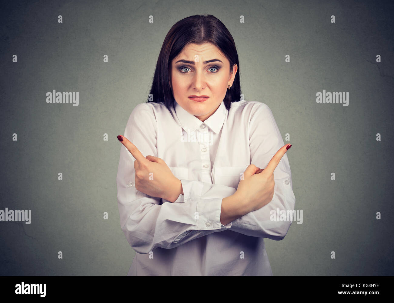 Perplexed confused woman uncertain which choice to make Stock Photo
