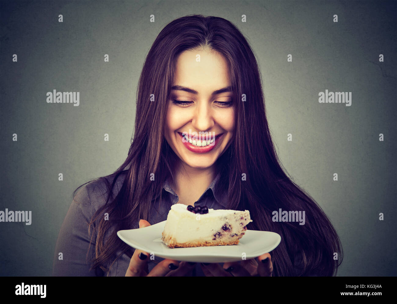 beautiful smiling young woman with a cake Stock Photo - Alamy