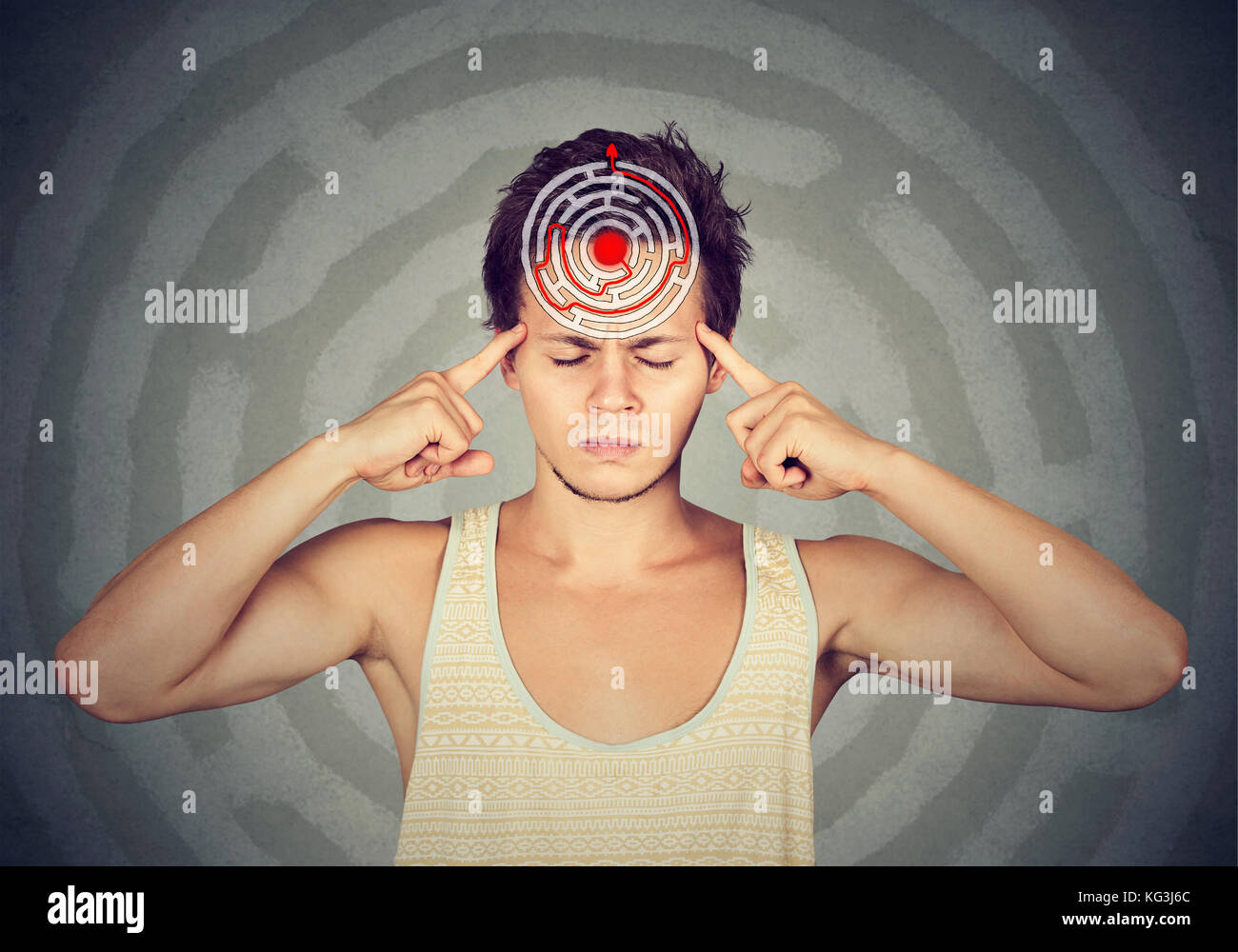 Problem solution concept. Young puzzled man isolated on gray wall background Stock Photo