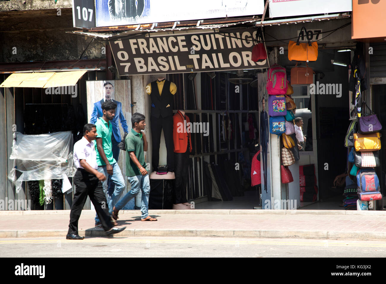 The Pettah Colombo Sri Lanka Main Street Men walking by tailors Stock Photo