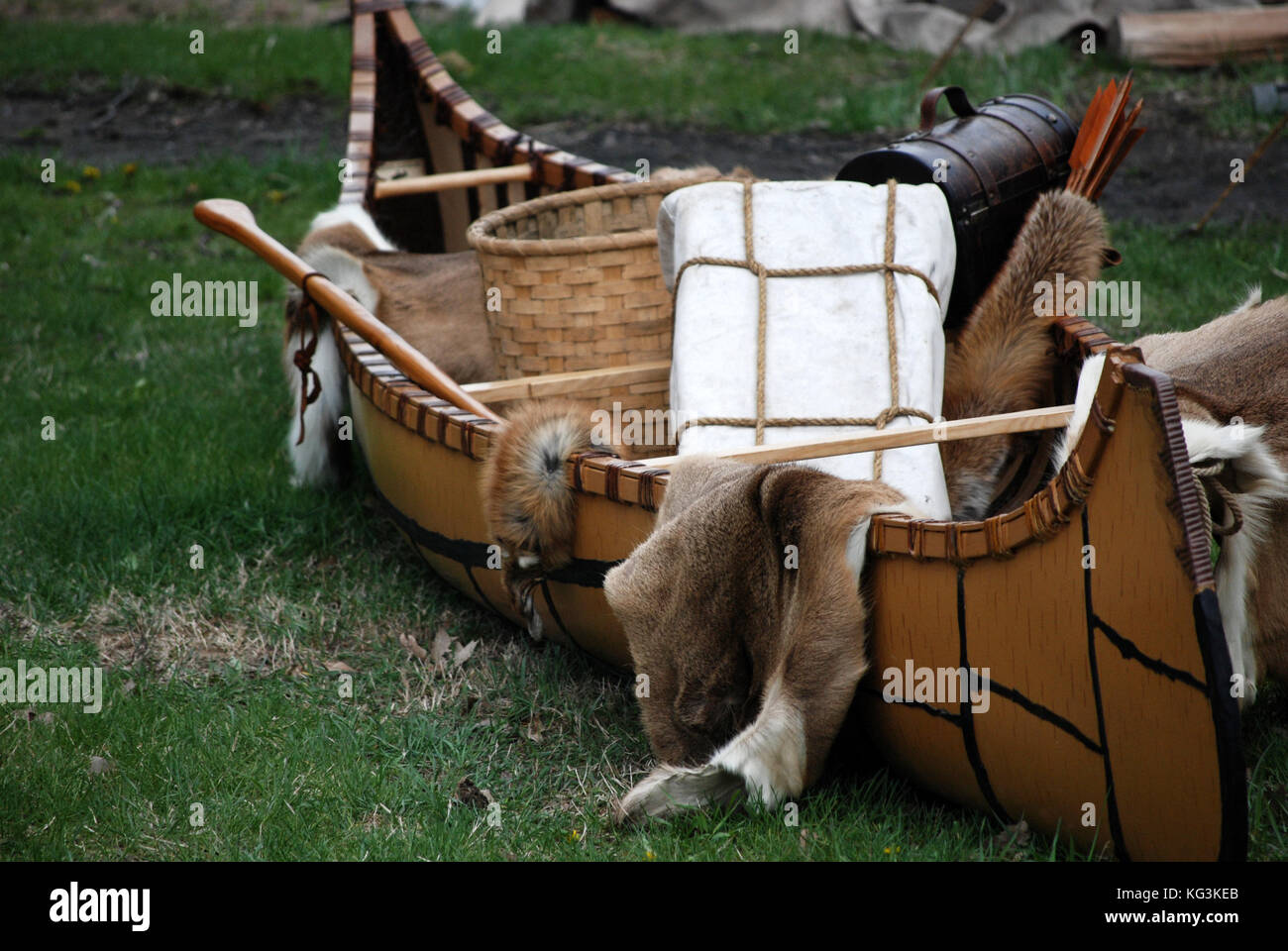 Homemade native American canoe with fur pelts and basket Stock Photo