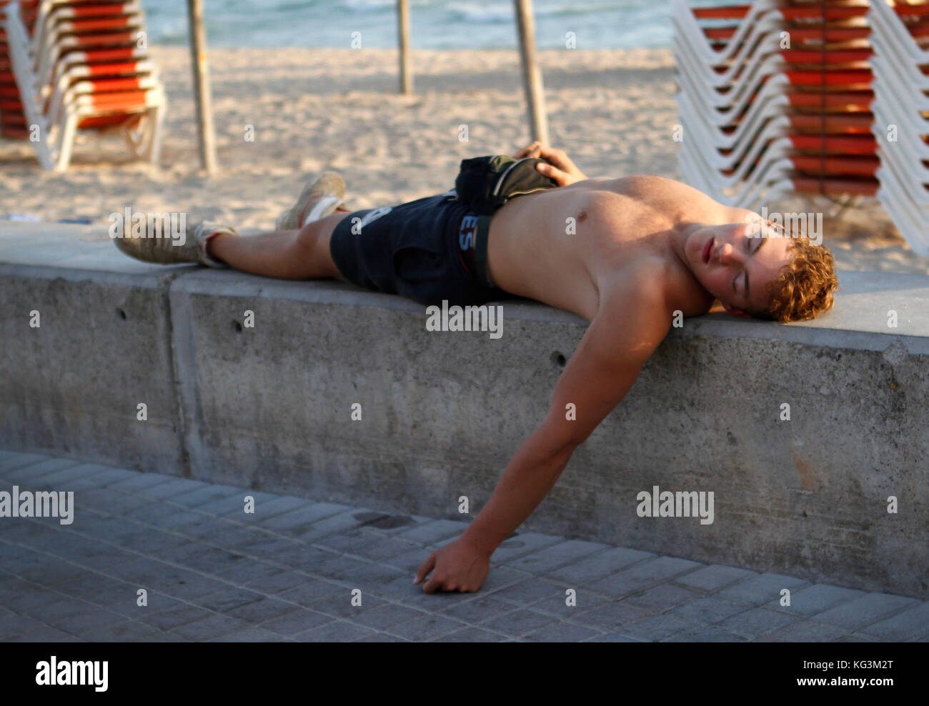tourist-sleeping-on-the-beach-of-arenal-