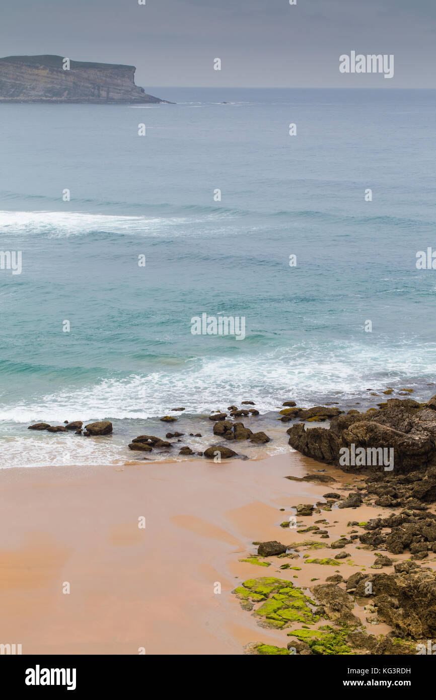 View of the sandy beach in cloudy foggy day. Spain, suburb of Suances, summer day in the Province of Cantabria, it is photographed from Playa de Los L Stock Photo