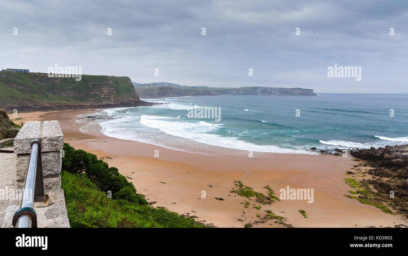 View of the sandy beach in cloudy foggy day. Spain, suburb of Suances, summer day in the Province of Cantabria, it is photographed from Playa de Los L Stock Photo