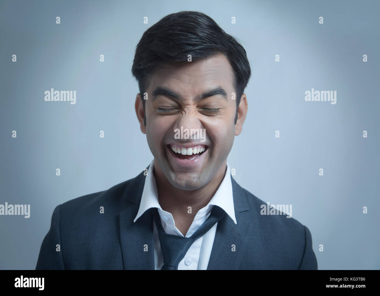 Young businessman making face Stock Photo