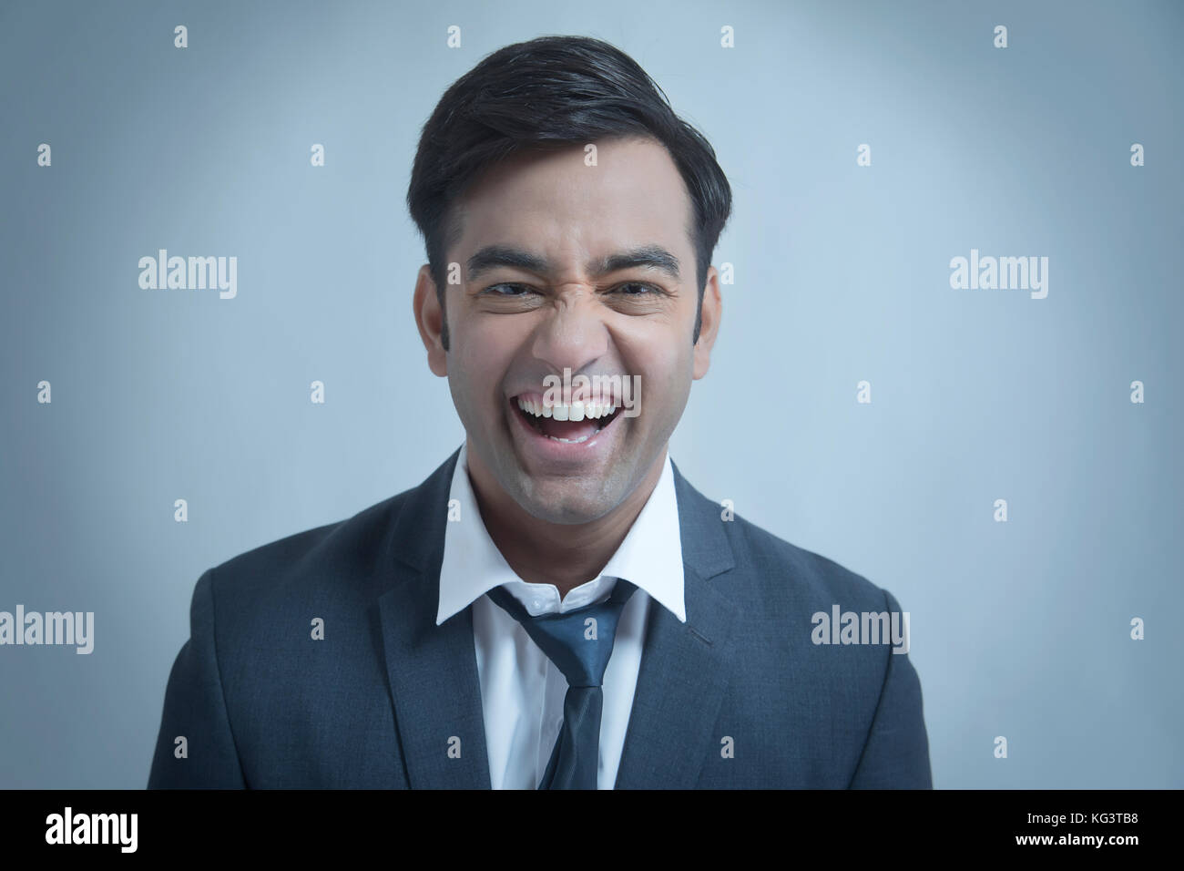 Young businessman smiling Stock Photo