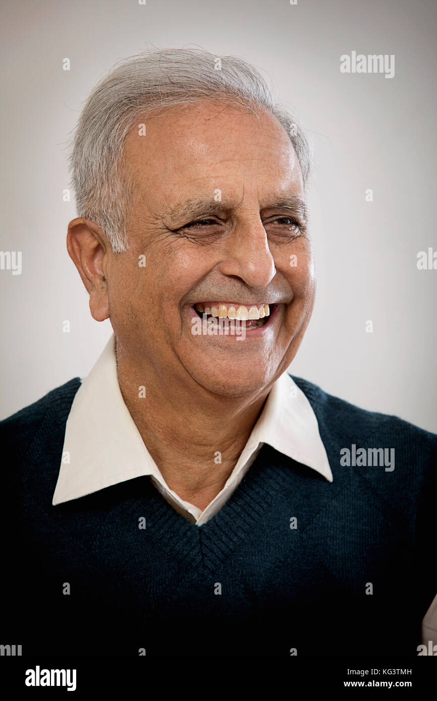 Portrait of smiling elderly man Stock Photo