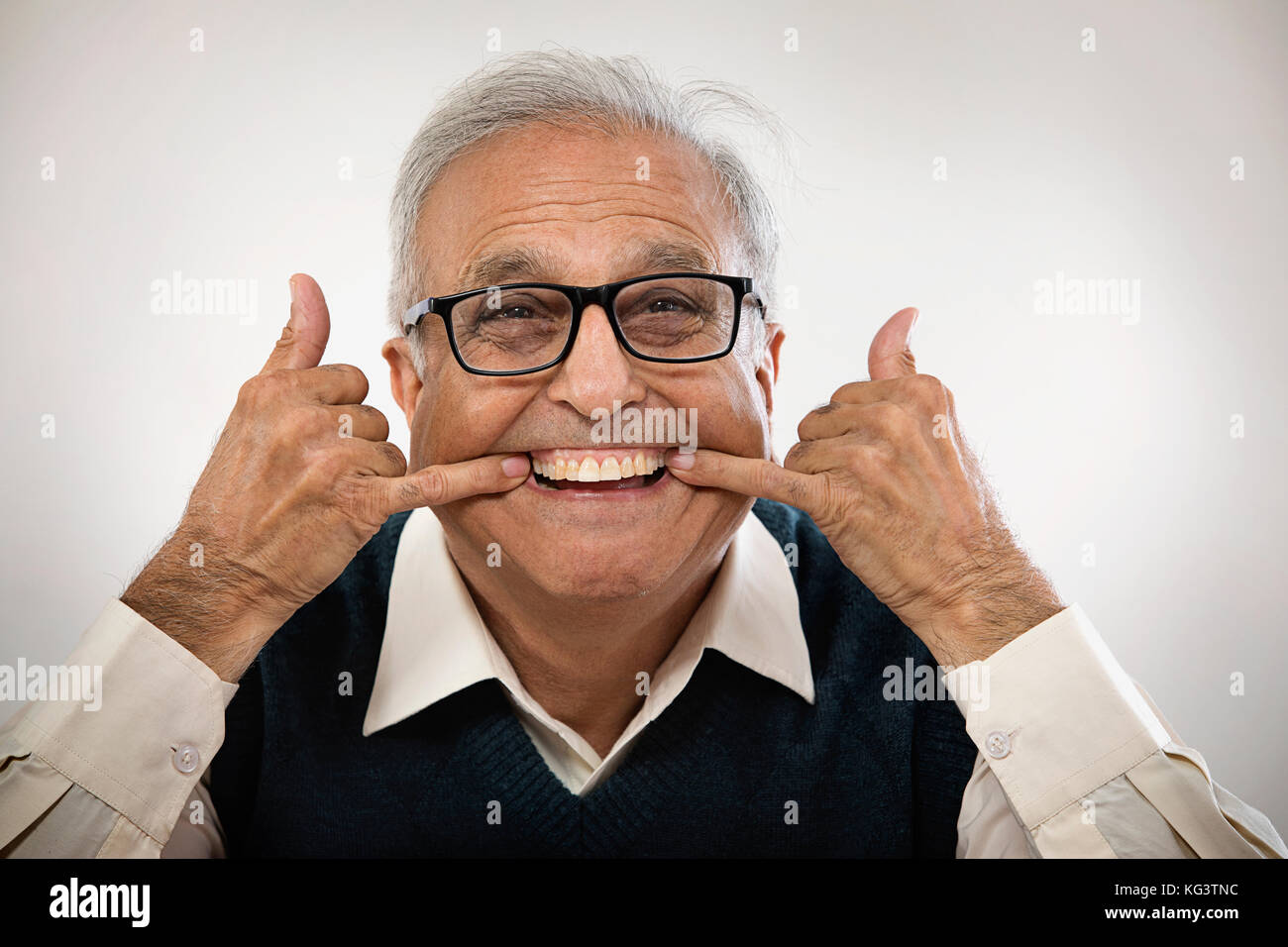 Senior man making funny face Stock Photo