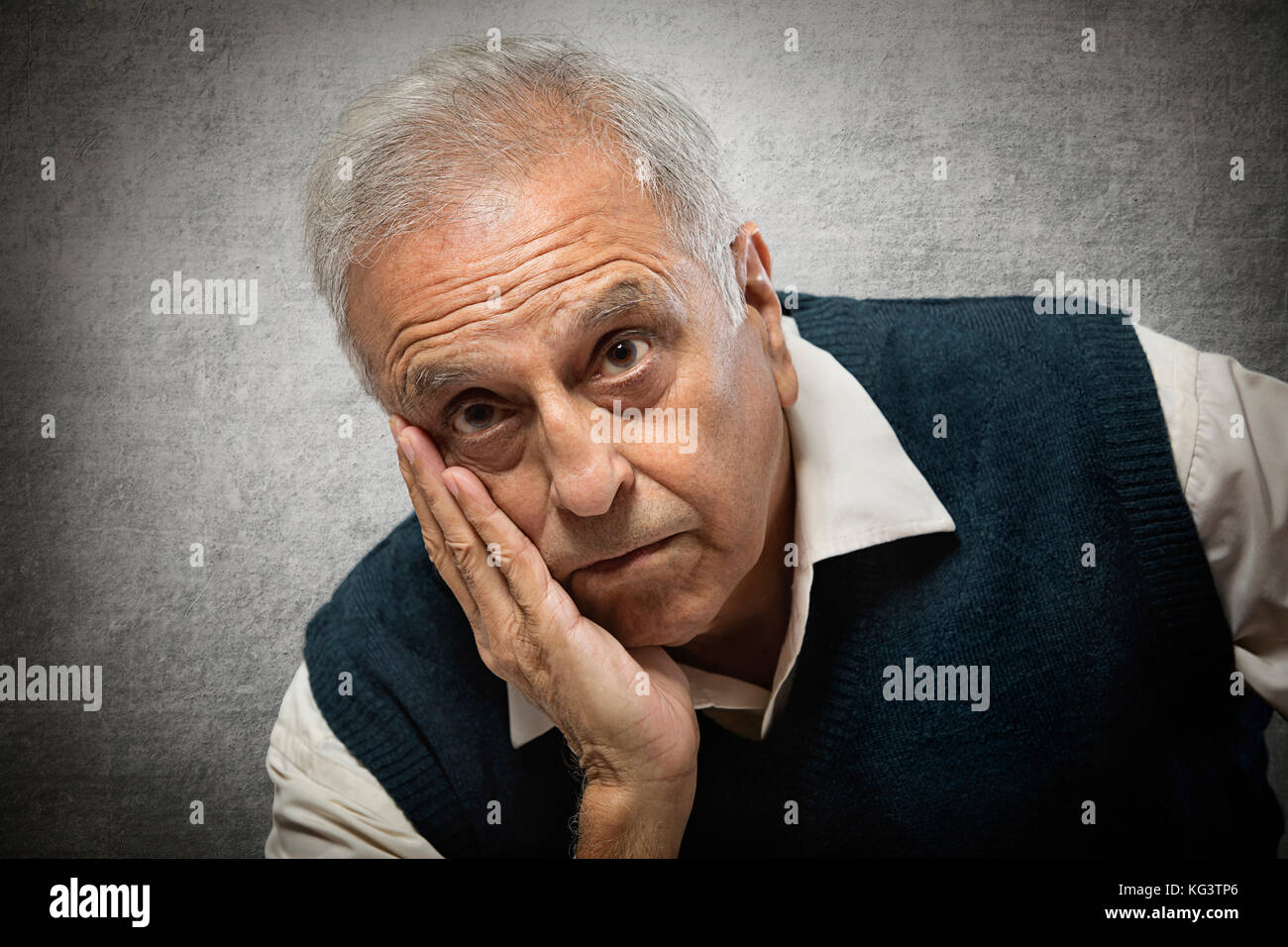 Portrait of a senior man with hand on face Stock Photo