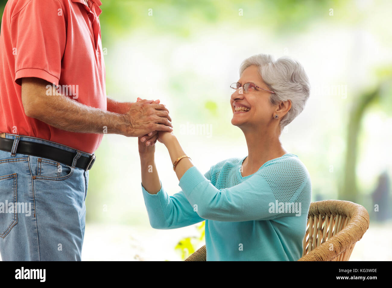 Senior man holding his wife hands Stock Photo