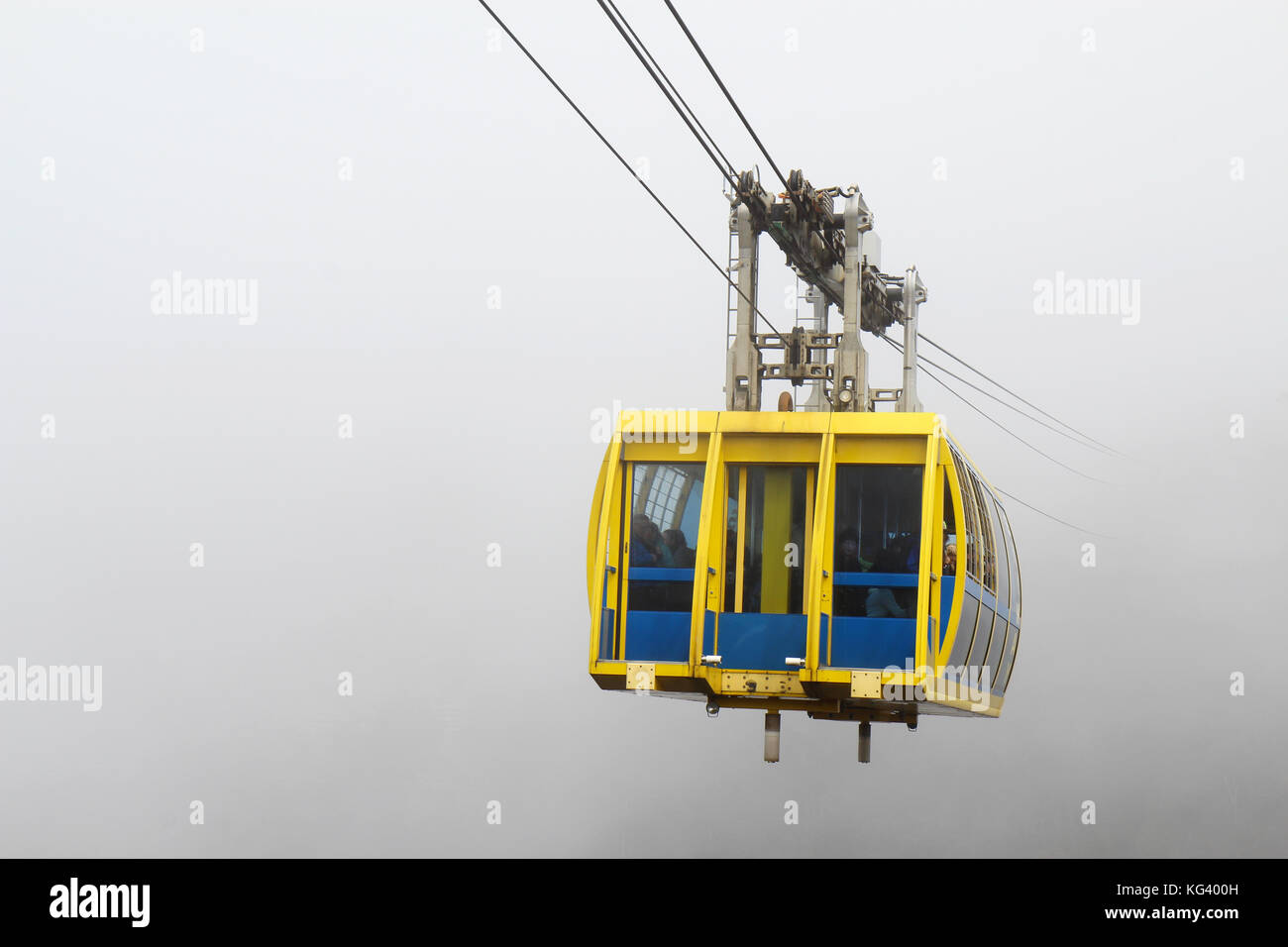KATOOMBA, AUSTRALIA - SEPTEMBER 25 2015: The Scenic World Skyway comes out of the mist that swirls around the Blue Mountains, a World Heritage site in Stock Photo