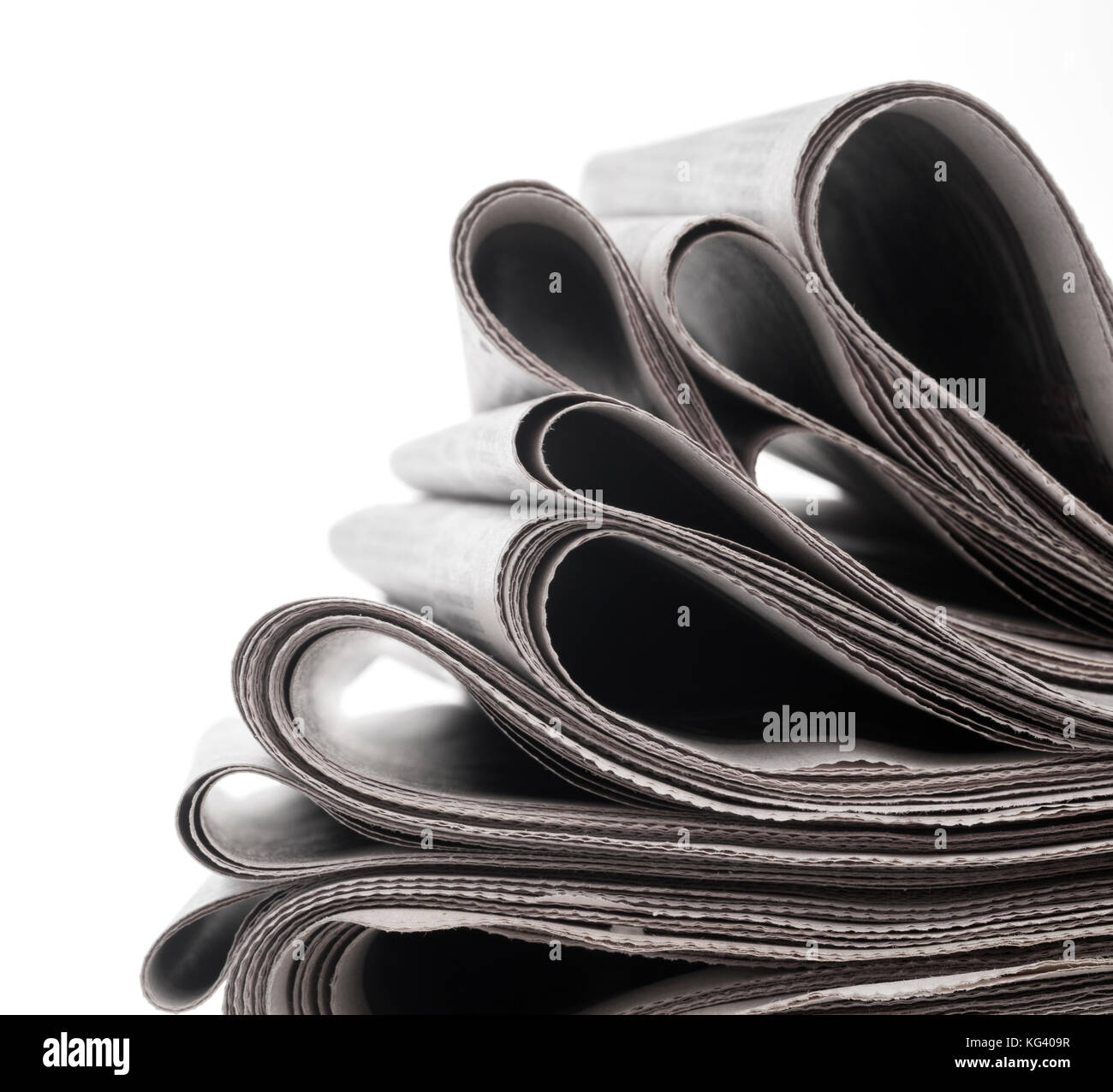 Newspapers folded and stacked concept for global communications Stock Photo