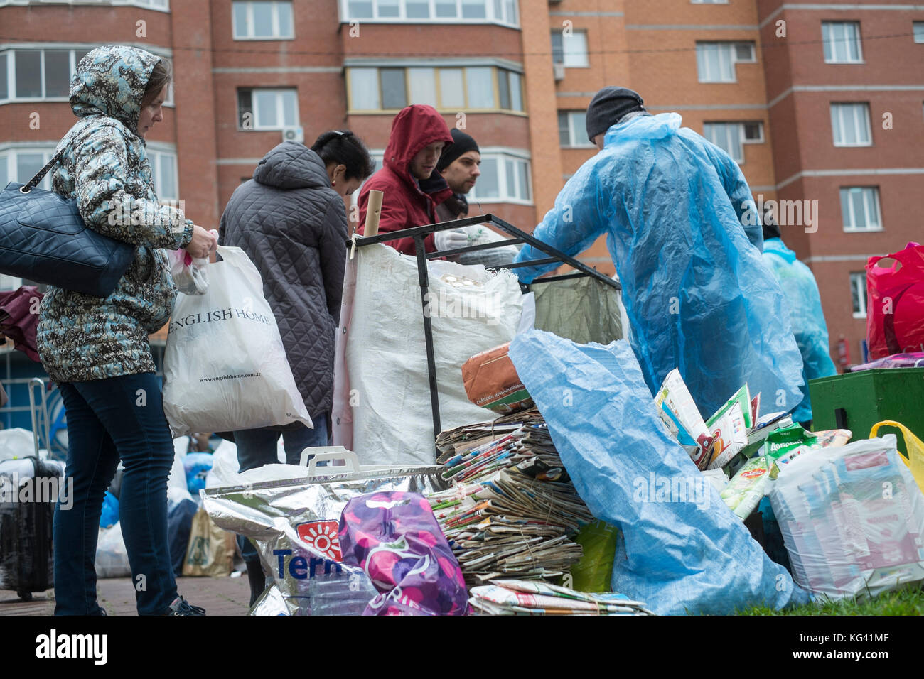 Volunteers collect household waste for recycling in a square in the town of Zheleznodorozhny, Moscow province, Russia. Local inhabitants have sorted their waste in advance at home in preceding weeks and can leave it in separate bags or containers here, for further transportation and recycling elsewhere. For now, the volunteers come here once a month, but the idea gains popularity. Waste sorting is still uncommon in Russia, where some ninety percent of household waste ends up at huge, open rubbish dumps.garbage Stock Photo