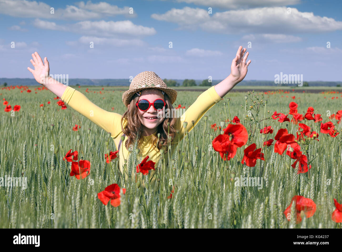 happy little girl on meadow spring season Stock Photo - Alamy