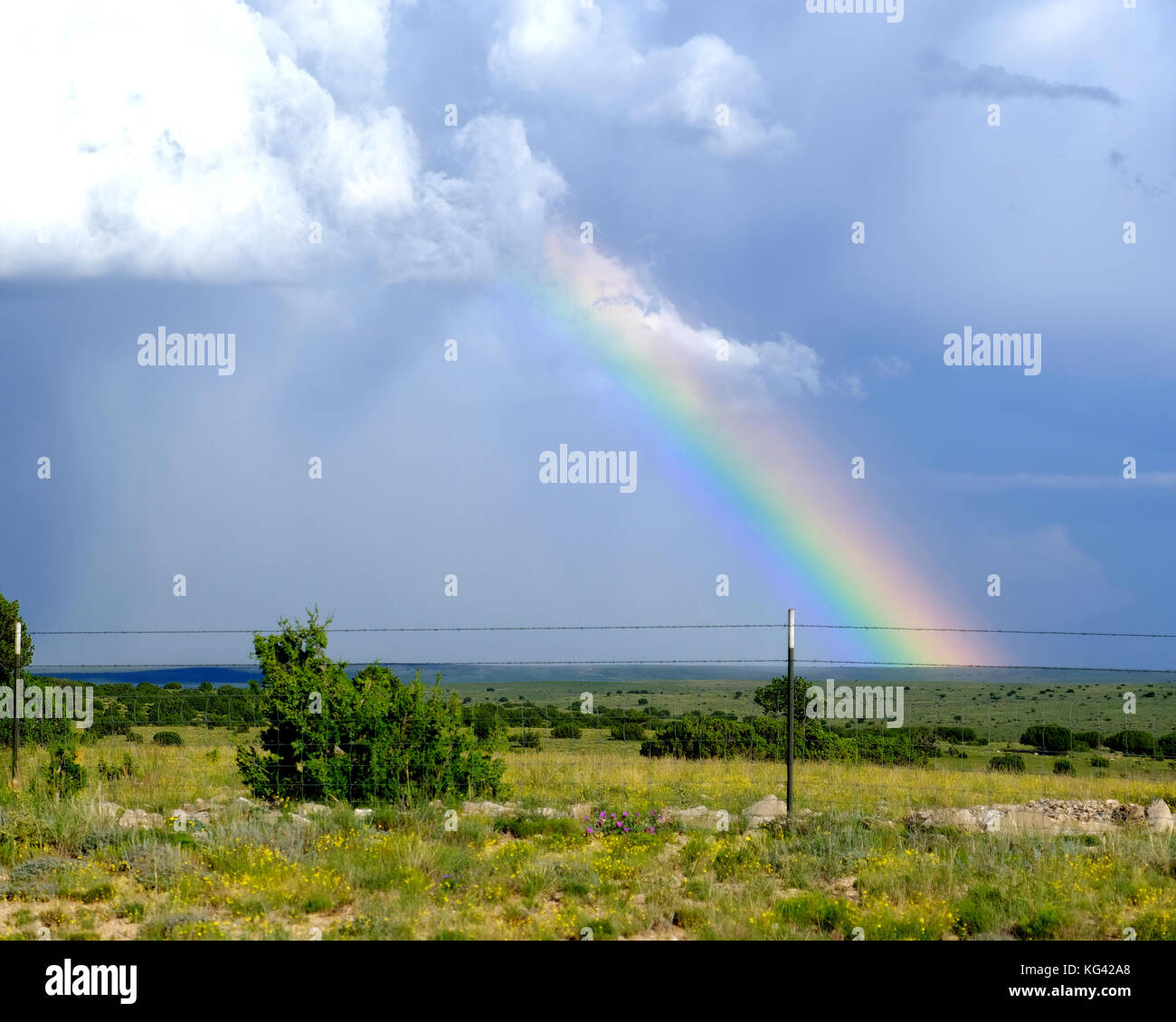 Rainbow over ranch land in rural New Mexico, USA. Stock Photo