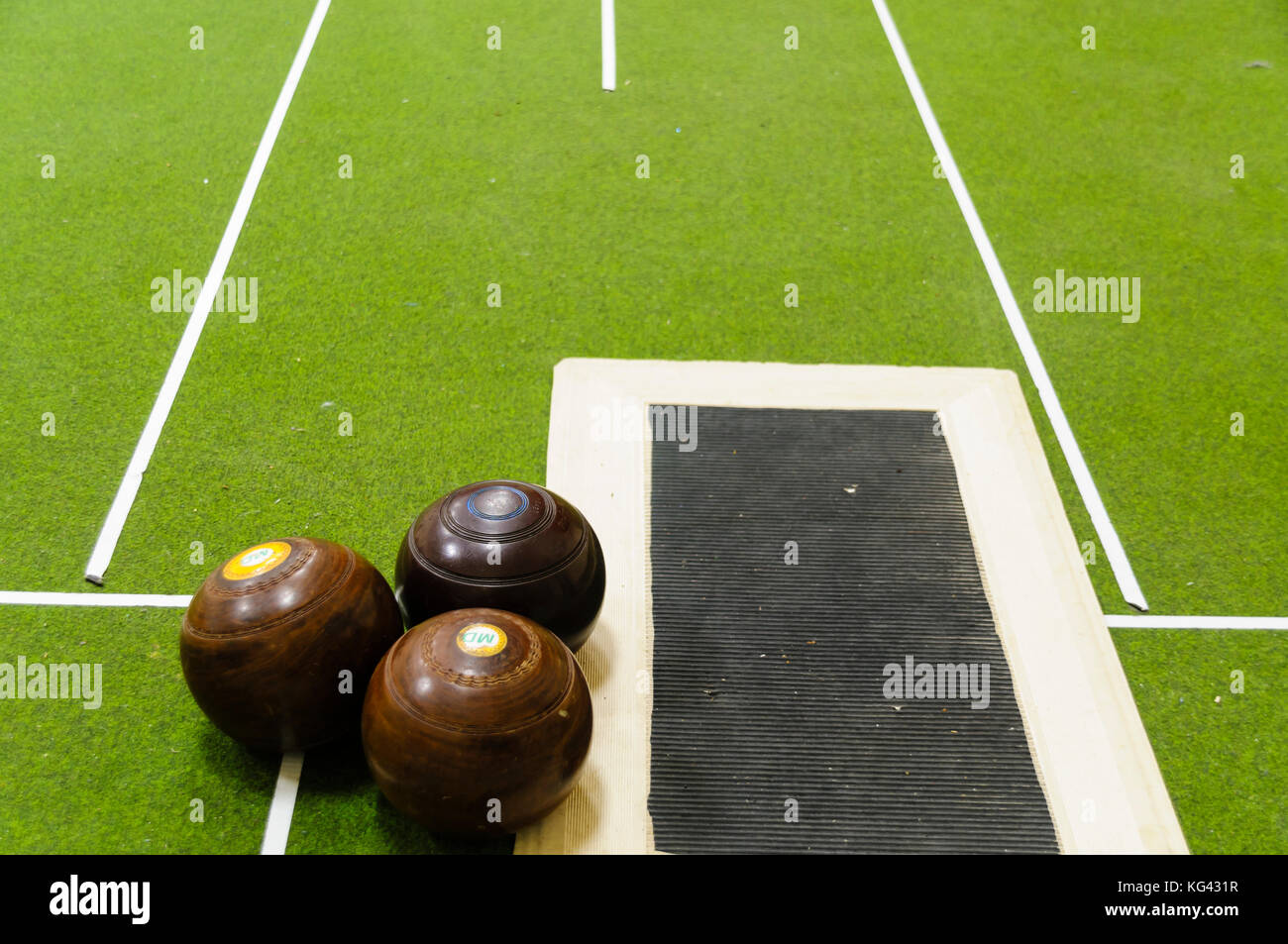 Bowls on an indoor bowls carpet Stock Photo