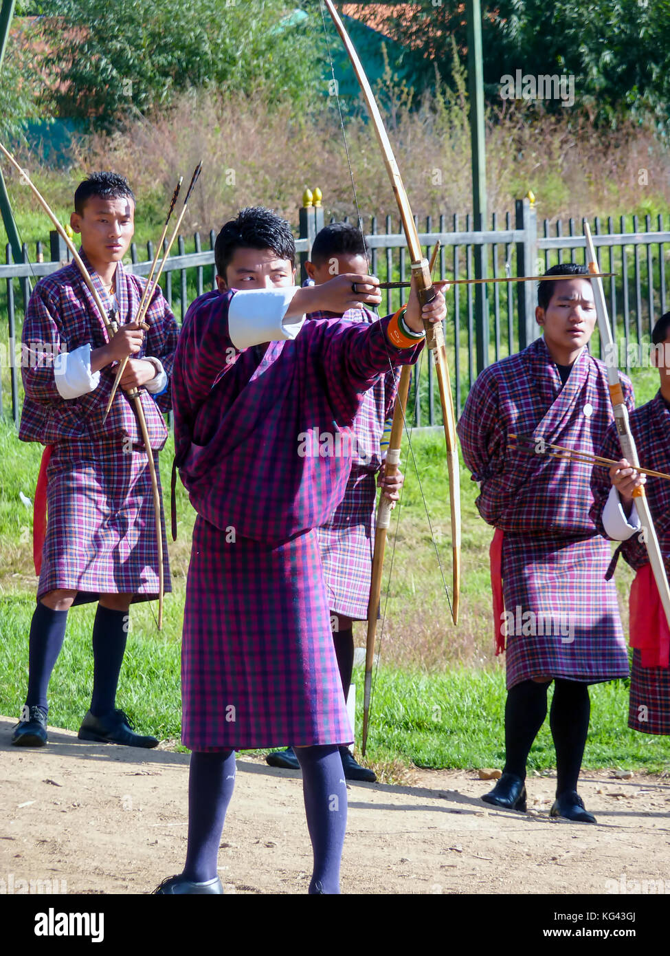 Bhutanese men competes in a game of archery in Timphu, Bhutan. Stock Photo