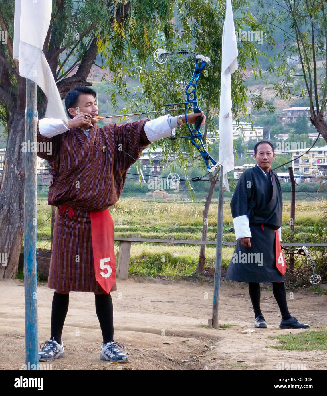 Bhutanese men competes in a game of archery in Timphu, Bhutan. Stock Photo