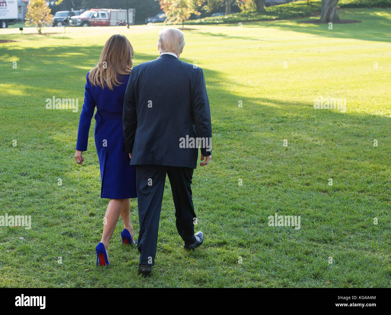 United States President Donald J. Trump and first lady Melania Trump walk on the South Lawn as they depart the White House in Washington, DC, November 3, 2017 for a multi-day trip to Hawaii and then on to Asia. - NO WIRE SERVICE · Photo: Chris Kleponis/Consolidated/dpa Stock Photo