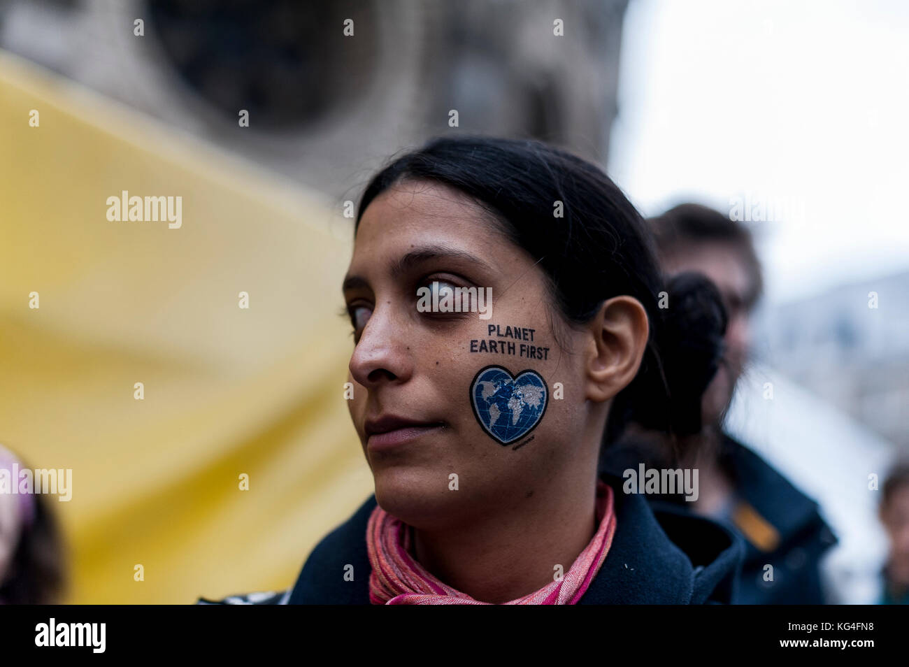 Bonn, Germany. 4th Nov, 2017. A woman has a pull-off tattoo with the inscription ''Planet Earth first'' on the cheek. According to organizers, 25,000 people from around the world demonstrate for climate justice and 100 percent renewable energy in harmony with nature.The 23th United Nations Climate Change Conference, Cop 23, will take place from 06 to 17 November 2017 in Bonn. Credit: Markus Heine/SOPA/ZUMA Wire/Alamy Live News Stock Photo