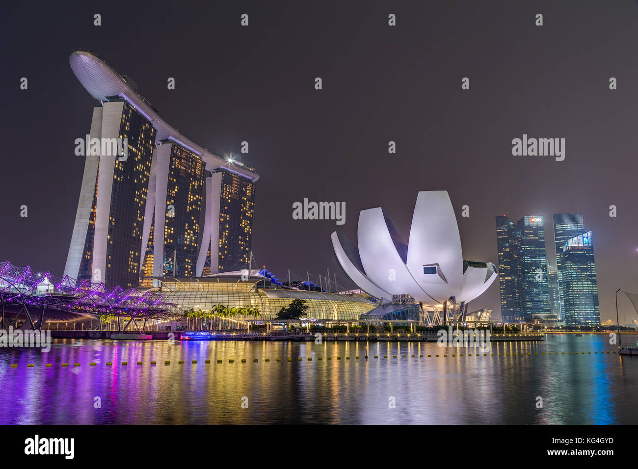 Singapore city lights, ArtScience Museum, Marina Bay Sands and Helix Bridge at night, Singapore Stock Photo