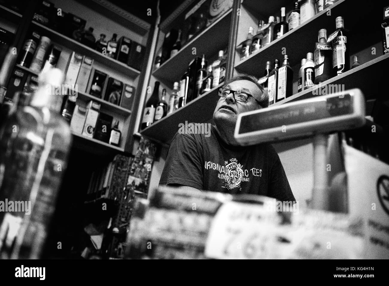 Isidre Vilanova, owner of the wine an spirits shop Vilanova that stands on the street Sant Antoni Abad of Barcelona, Spain, prepares a command for a client. Date: 15/09/2015. Photo: Xabier Mikel Laburu. Wines and Spirits Vilanova was founded as a small supermarket in 1950 by the father of Isidre Vilanova, who is the owner of the shop. To survive the changes in the consumption patterns he switched from a general food supermarket to a shop specialized in wines and spirits. Isidre will pass on the business to his son who will continue with the family business. Stock Photo