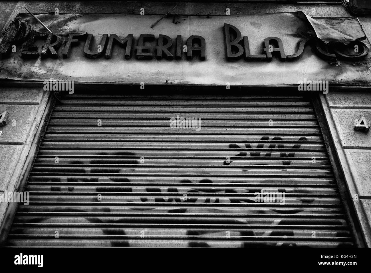 A current picture of the closed blind from the Blasco perfume shop in Tallers street of Barcelona. Date: 07/09/2015. Photographer: Xabier Mikel Laburu. The grandfather of Enric Blasco inaugurated the shop in 1900. Enric remembers how he grew up with all the smells and had very clear he wanted to continue with the family tradition. In 1955 he started to work full time in the shop and would take over it when his father retired. Blasco closed the shop in January 2005 for retirement, his son did not want to take over the business. Stock Photo