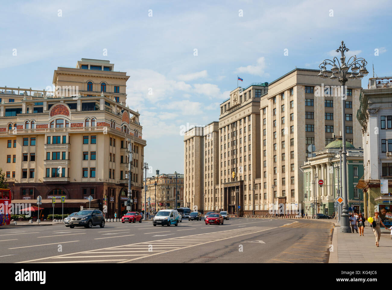 View of Okhotnyy Ryad street and Teatralnaya Square with the Moscow City Duma building in the Moscow Tverskoy District on a sunny day. Moscow, Russia. Stock Photo