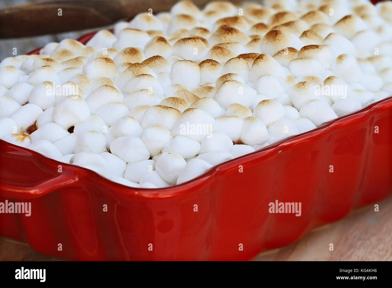 Sweet Potato Casserole baked with mini marshmallows ready for Thanksgiving Day. Extreme shallow depth of field with selective focus. Stock Photo