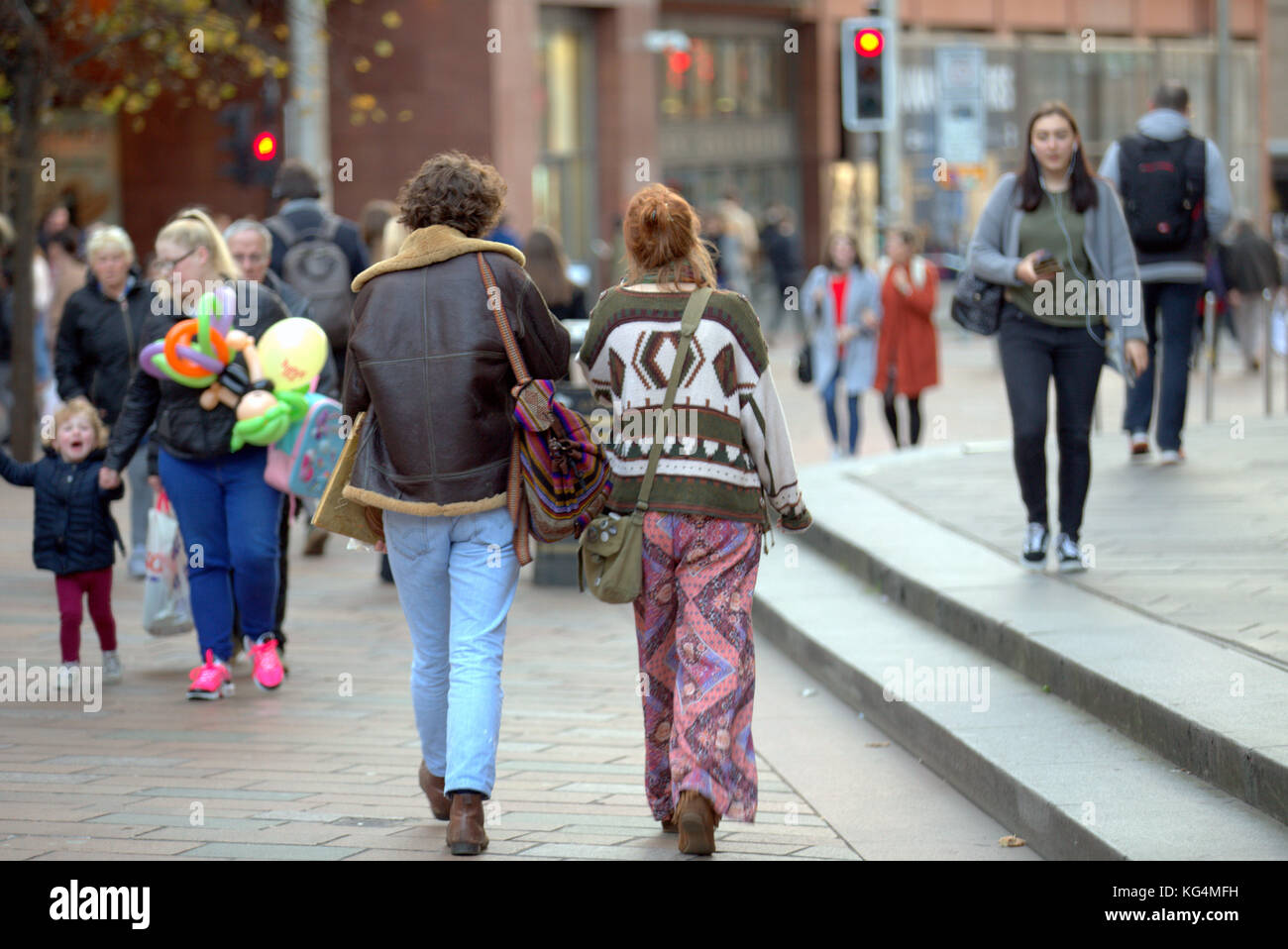 1960's  style fashionista street fashion young trendy couple viewed from behind Buchanan Street, the style mile Glasgow United Kingdom Stock Photo