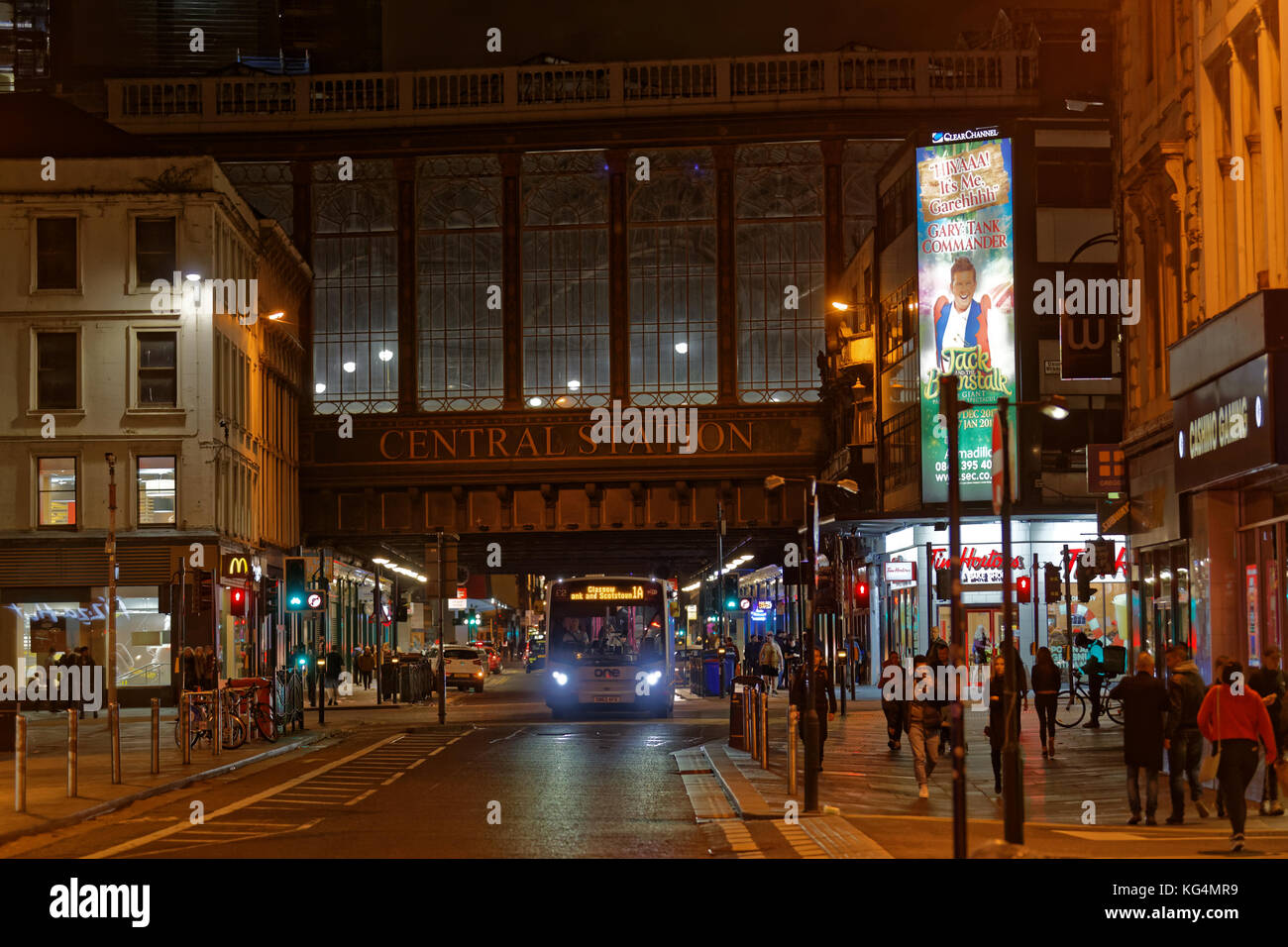 central station highlanders umbrella argyle street  mcdonald's restaurant fast food glasgow traffic and pedestrians Stock Photo