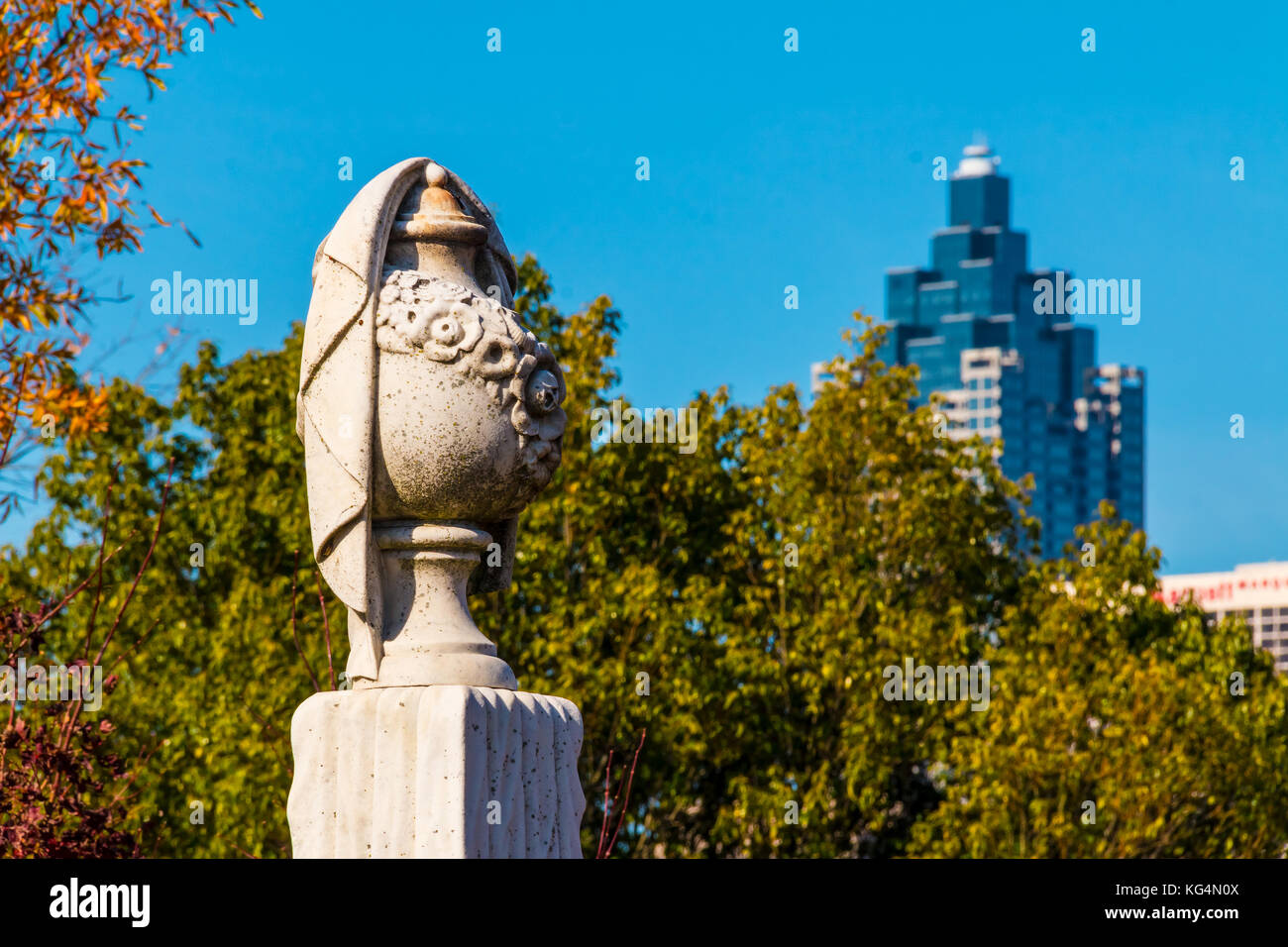 The gypseous sculpture of funeral urn on the Oakland Cemetery in sunny autumn day, Atlanta, USA Stock Photo