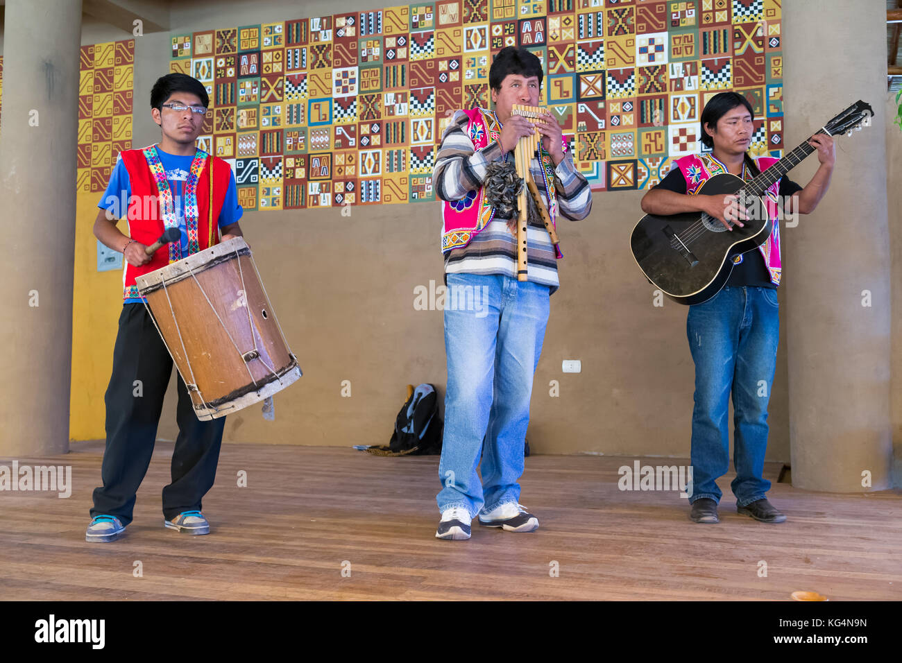 Musicians perform in traditional Peruvian clothes near Puno, Peru Stock Photo
