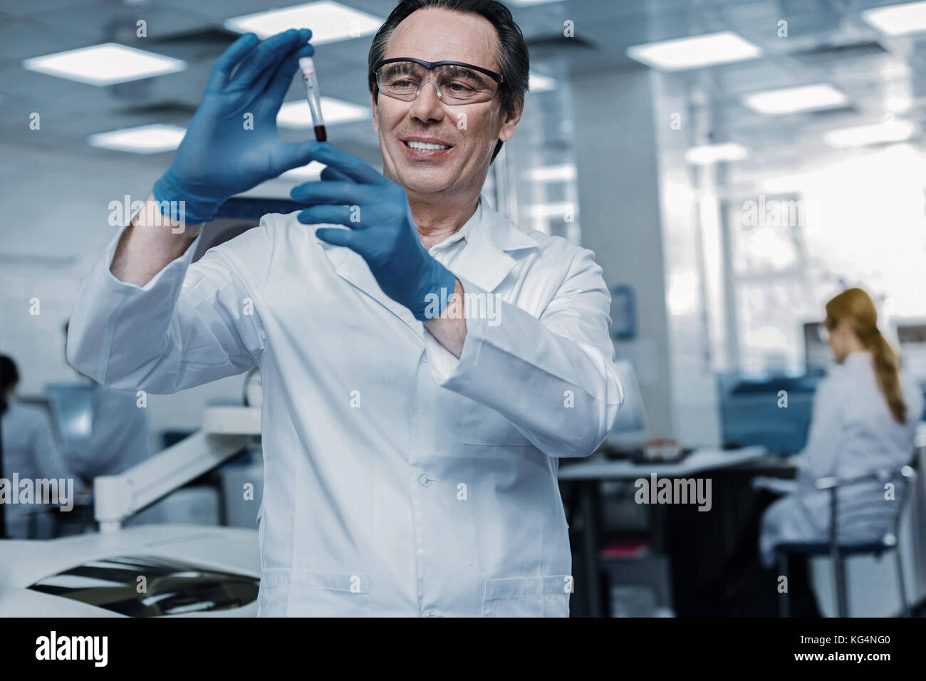 Smart genius scientist looking at the vaccine Stock Photo