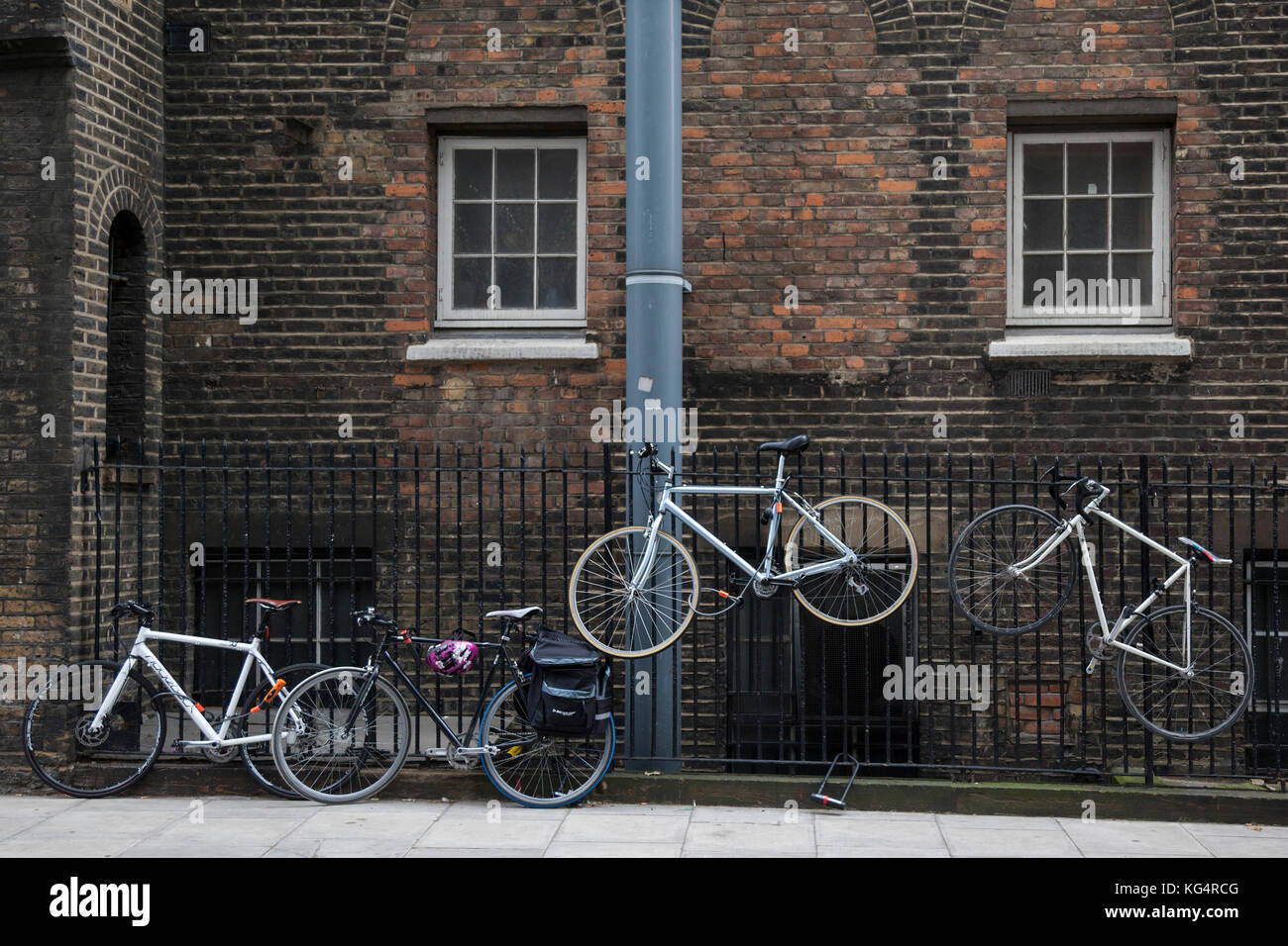 Quirky bicycle parking on rails, London, England, United Kingdom Stock Photo