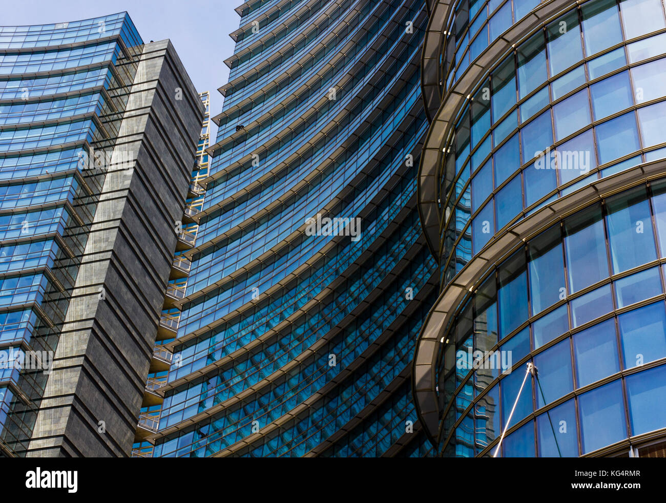 MILAN, ITALY - MAY 10 2014: Architectural detail of the glass facade on the Unicredit tower building in Milan, the tallest skyscraper in Italy Stock Photo
