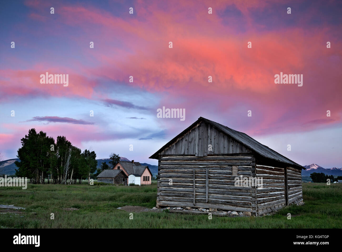WY02544-00...WYOMING - Sunset over an old homestead on Mormon Row in Grand Teton National Park. Stock Photo