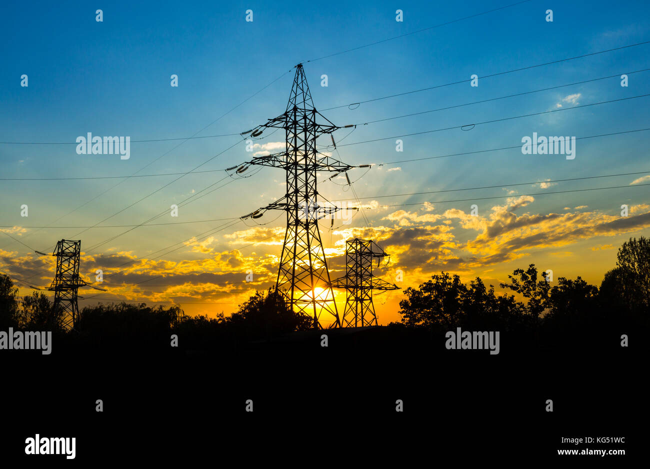 The silhouette of the evening electricity transmission pylon Stock Photo