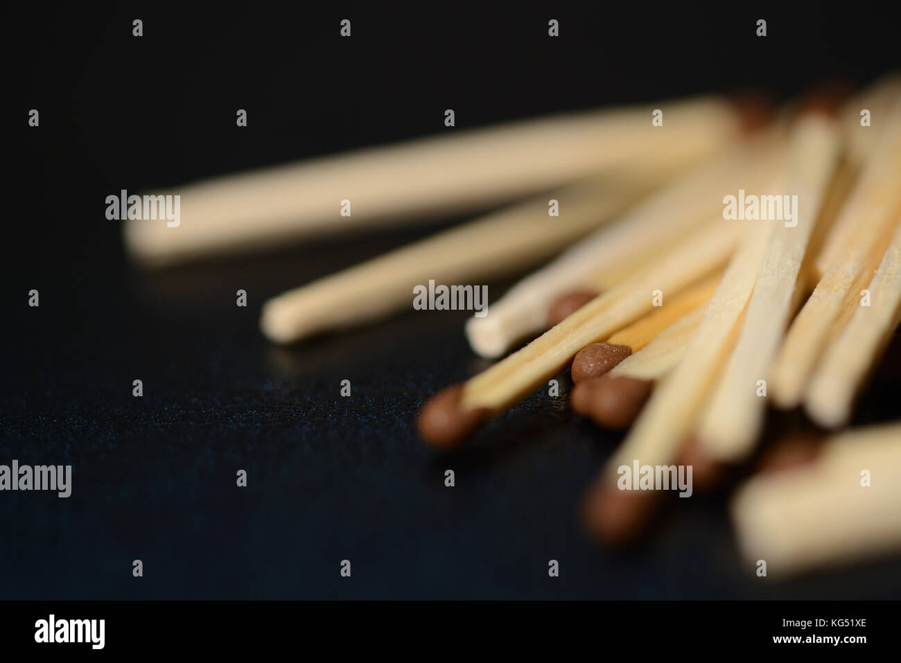 Scattered matches on dark background close up Stock Photo