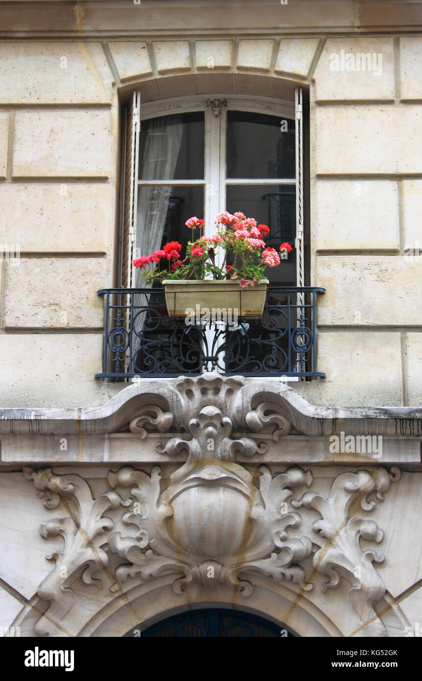 Renaissance window with red flowers Stock Photo - Alamy