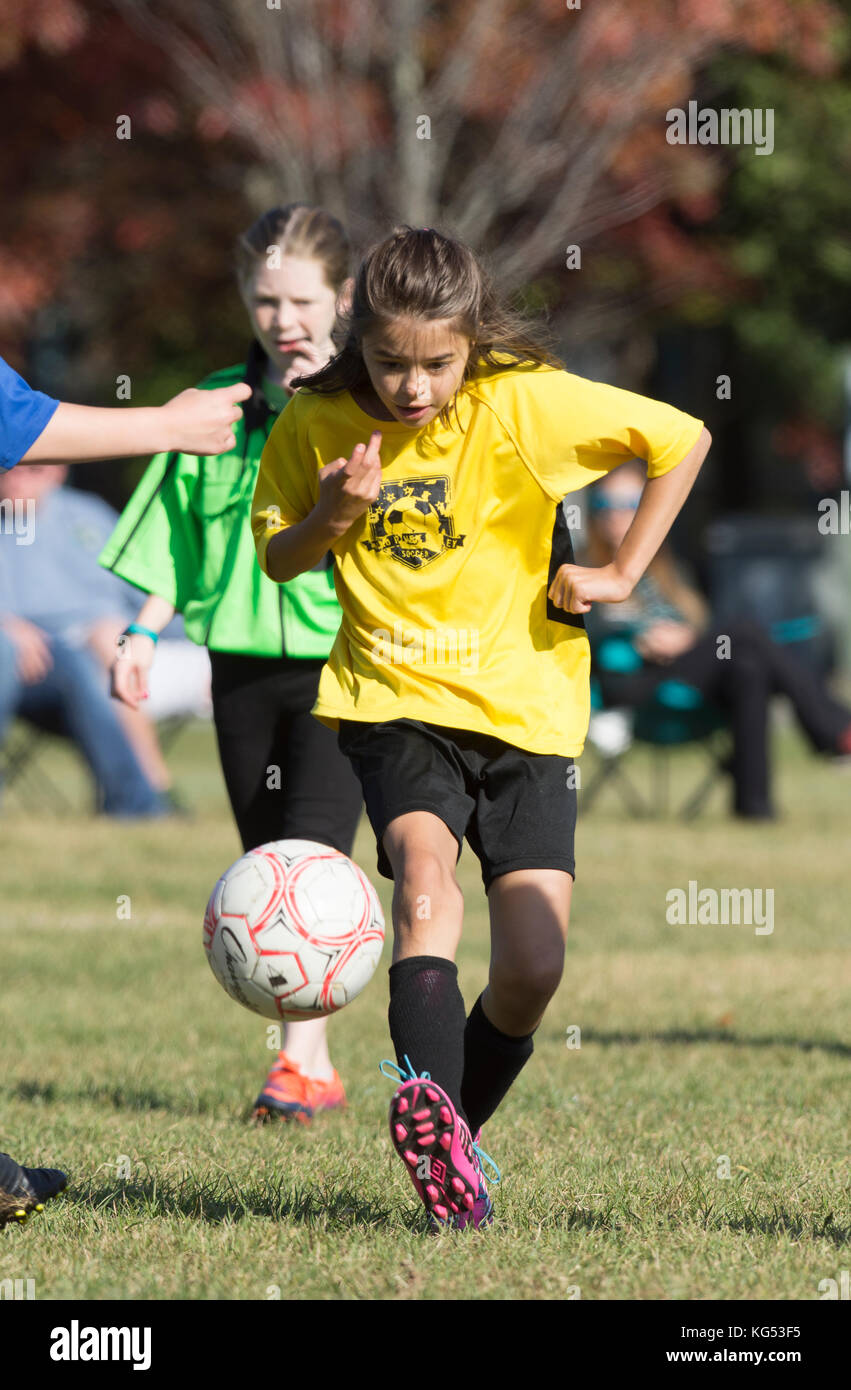 A 9 yr. old girl in a youth soccer match in Moretown, Vermont Stock Photo