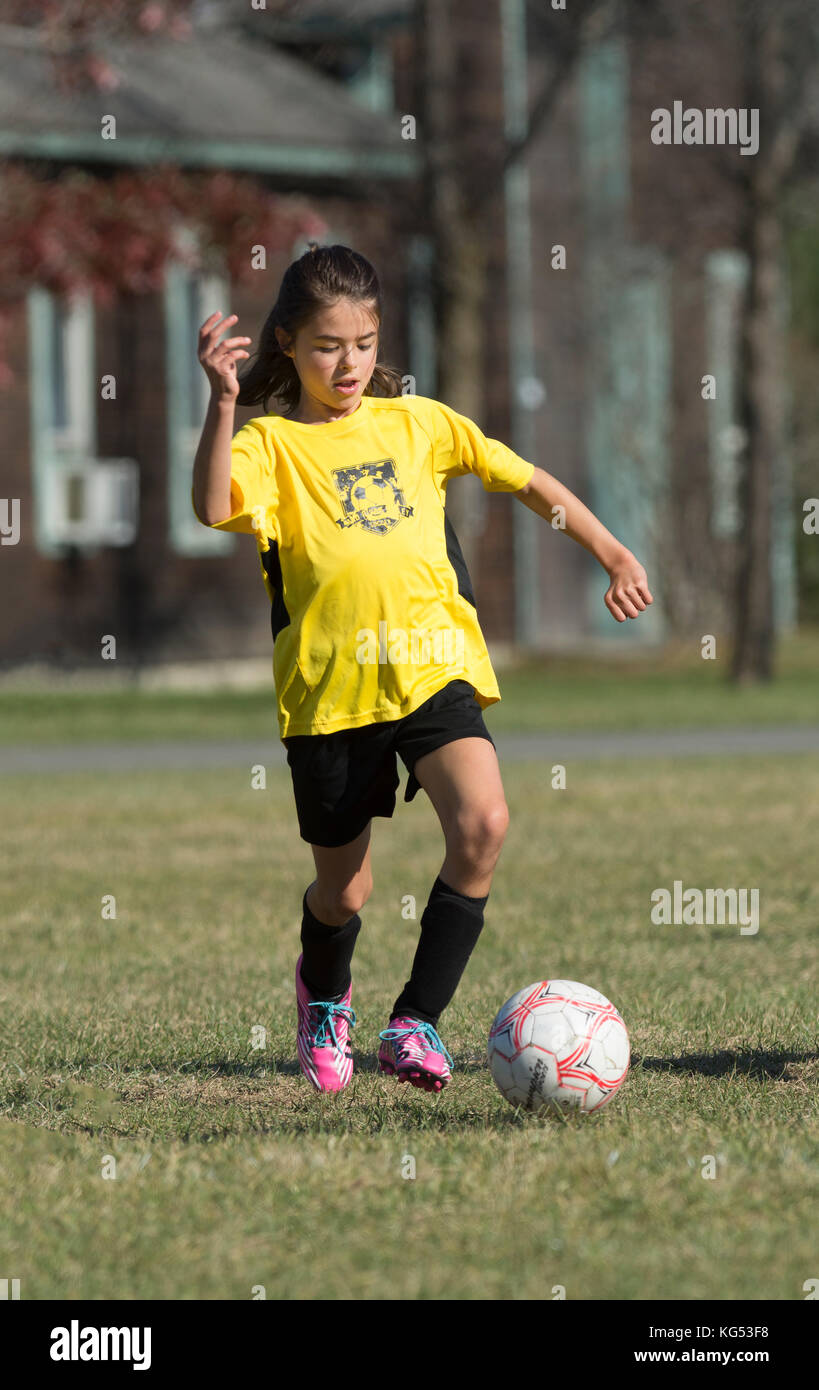 A 9 yr. old girl in a youth soccer match in Moretown, Vermont Stock Photo